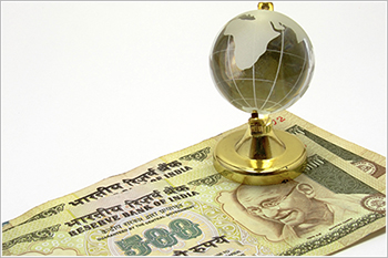 Indian currency and globe
